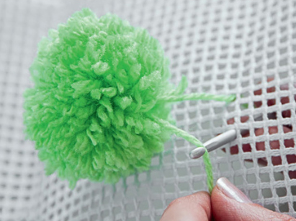 3.Attach the pompom by sewing to the net