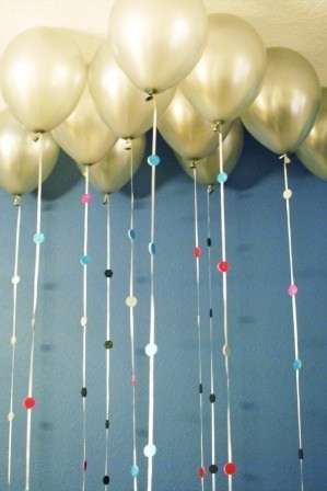 Attach sparkly foam circles to balloon strings.