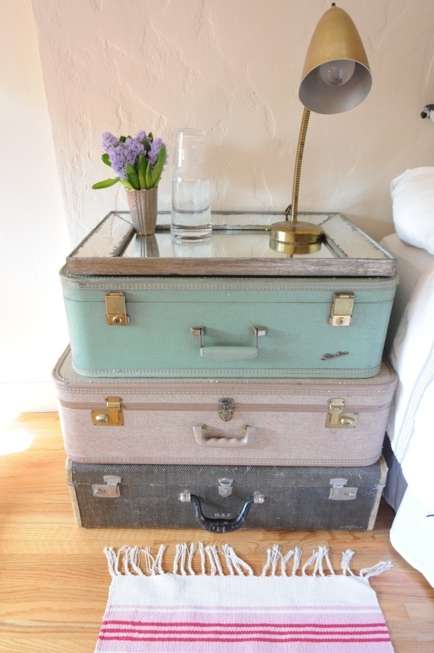 bedside table from vintage suitcases and an old mirro
