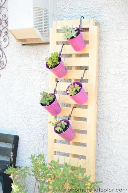 bucket planters on the wall
