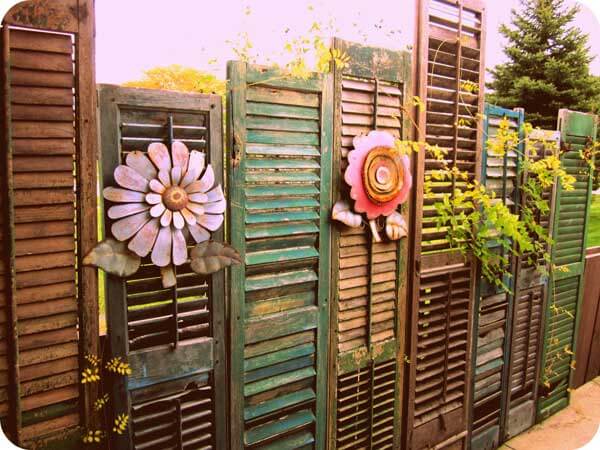 Fence made of assortd old shutters