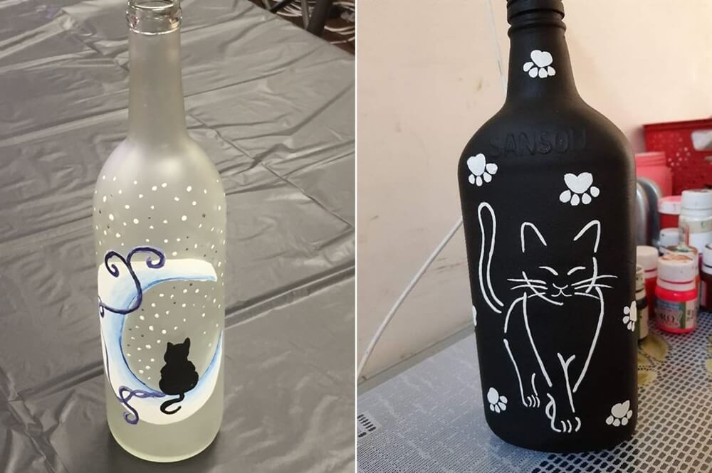 painted glass bottles with cats