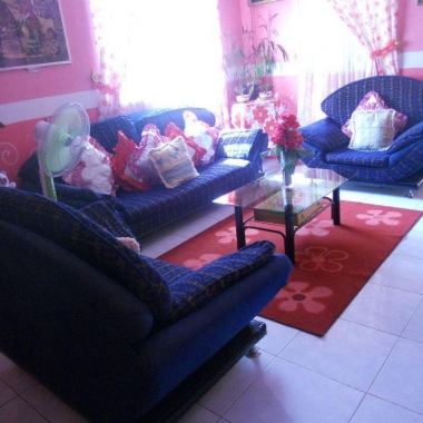 living room with red sofa
